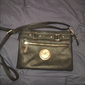 Micheal Kors cross body purse.